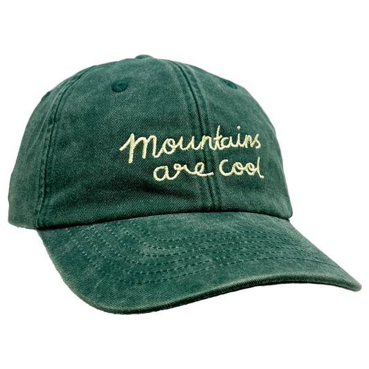 Green cap with 'Mountains are Cool' embroidered text on a transparent background